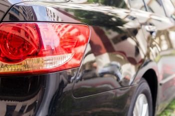 Focus closeup of Car rear light, Detail of modern car rear lamp black color