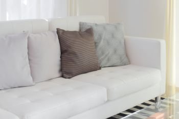 Pillows on white sofa in living room