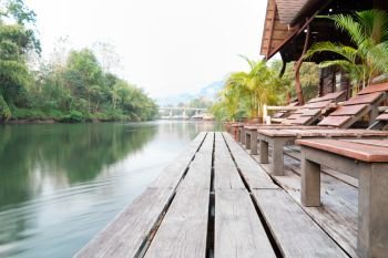 the river Kwai view at rafting cottage terrace on sunset