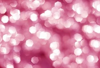 Abstract pink background with a large silver bokeh, polygon shape