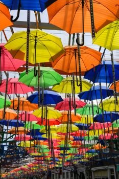 Roof above the street decorated with many colorful umbrellas in Huis ten bosch in Nagasaki, Japan