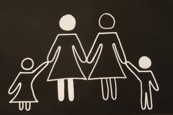 two moms and her children on blackboard