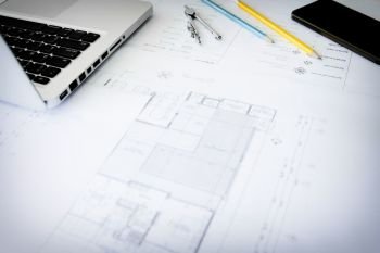 Construction equipment. Repair work. Drawings for building Architectural project, blueprint rolls and divider compass on table. Engineering tools concept. Copy space.