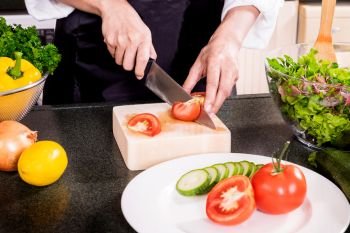 Healthy Woman makes fresh vegetable salad with olive oil, tomato and salad