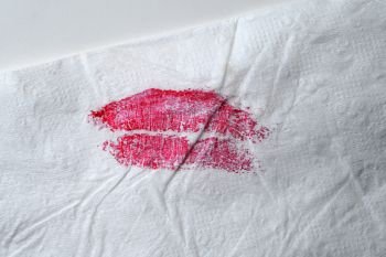 red lipstick on tissue