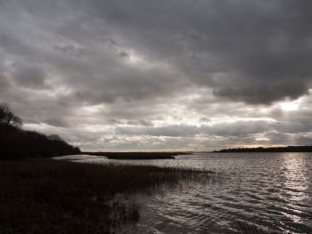 moody sky clouds autumn winter grey dark bay ocean river estuary; essex; england; uk