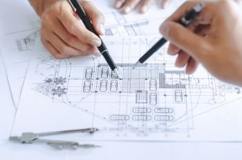close-up engineer team Drawing Plan on Blue Print with architect equipment