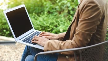 woman creative business using laptop at a outdoor with nature
