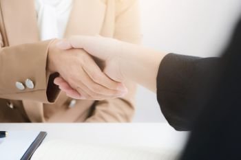 business partnership shaking hands agreement deal