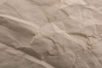Brown color wrinkled paper as a background