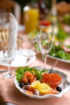 Sea Food mini set with caviar and salmon on table