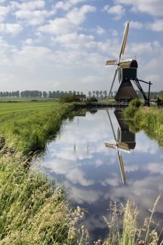 The Wingerdse mill near Bleskensgraaf. The Wingerdse mill near the Dutch village Bleskensgraaf reflecting in the pond
