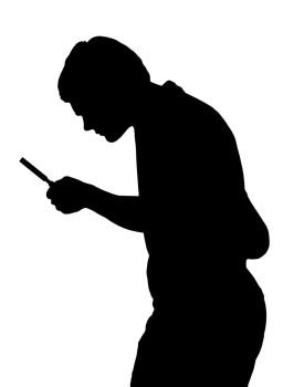 Silhouette of a teenage boy investigating with a magnifying glass 