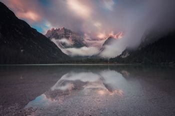 Mountain lake at bright sunrise. Lago di Landro, Dolomites Alps, Italy