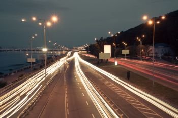 Night city traffic on highway road