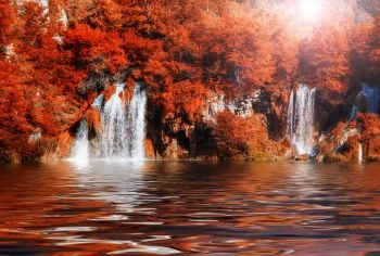 Beautiful fall colors forest waterfall and lake. Plitvice National Park, Croatia.