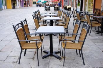 Old european city street cafe table, Venice, Italy
