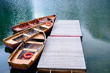 Wooden boats at the Alpine mountain lake