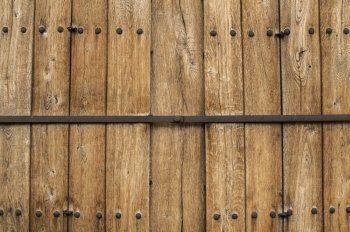 Old wooden weathered boards wall closeup as background