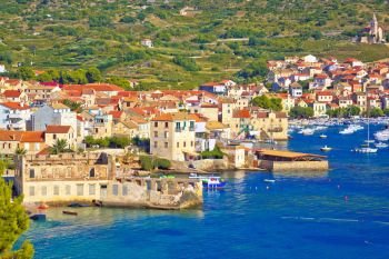 Idyllic town of Komiza on Vis island summer view, Dalmatia archipelago of Croatia