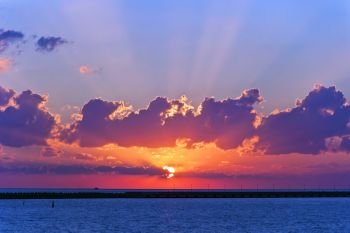 Lanscape evening calm sea with purple sunset. Evening calm sea with purple sunset