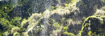 Abstract Waterfall Background. Abstract water droplets waterfall background with green moss 