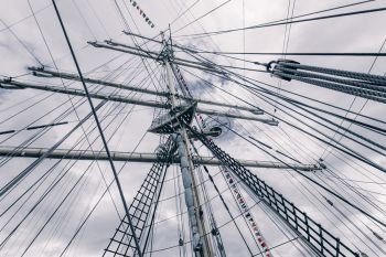 Old sailing ship mast. Tall ship rigging detail.  Masts and rigging of a sailing ship