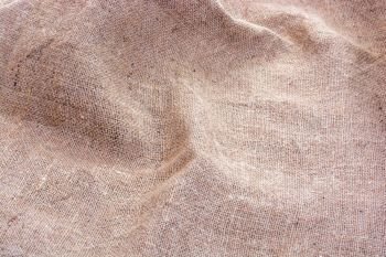 wrinkled Hessian sack cloth or gunny sack, selective focus