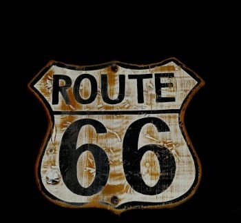 Historic old Route 66 black sign.