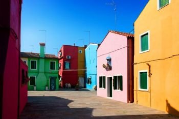 Colorful houses on the street of Burano in Italy. Houses of Burano