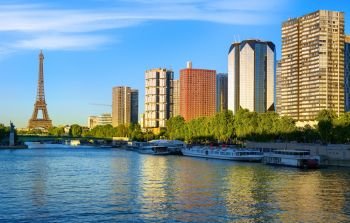 Modern district of skyscrapers on Seine with view on Eiffel Tower in Paris, France