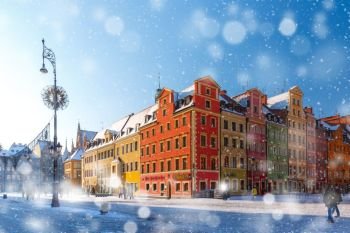 Market Square in Wroclaw, Poland. Multicolored traditional historical houses on Market square in the winter snowy morning, Old Town of Wroclaw, Poland