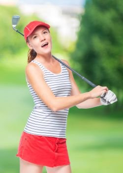 Golfer in cap with golf club on a background of golf courses