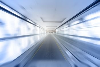 Travelator in motion - abstract business and architectural background
