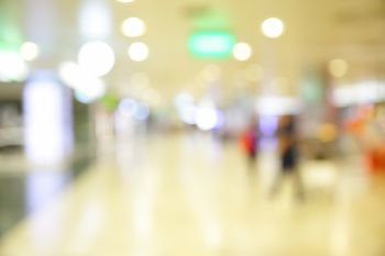 Hall with shops in airport out of focus - defocused background