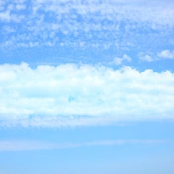 Strip of clouds in the blue sky, may be used as background