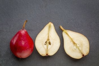 red pears on a gray slate stone background