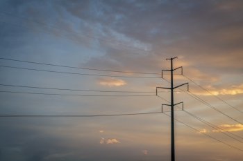 power line silhouette against sunset sky