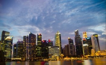 Singapore ,April 3 -2016 Business buildings shining of light at night time around Marina Bay and river Singapore  Singapore  April, 3 , 2016