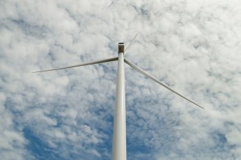 windmill for renewable energy with beautiful sky background