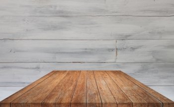Perspective brown table top with white wooden wall background, stock photo