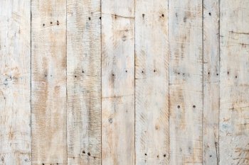 Grungy white paintwork on a wooden panel