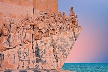 Stone ship shaped Monument to the Discoveries hailing Portugals famous navigator and history, Portugal at sunset
