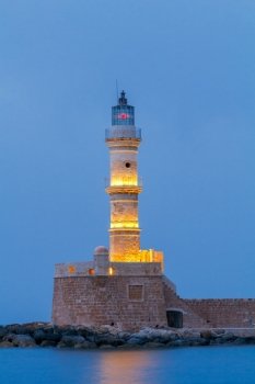 Chania. Old harbor at night.. Old stone lighthouse in the Venetian harbor of Chania. Greece. Crete.