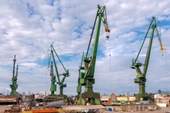 Gdansk. Sea port.. Large cranes on a pier in the seaport of Gdansk.