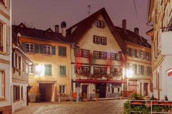 Strasbourg. Petite France district in the old city.. Half-timbered house on the canal at night in Strasbourg. Alsace.