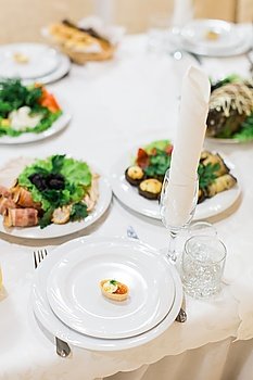 Banquet wedding table setting on evening reception