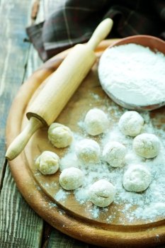 flour balls on board and on a table
