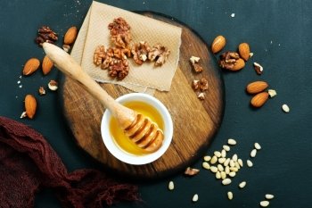 honey with dry almond on a table