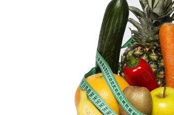 Vegetables and fruits wrapped in measuring tape on a white background. Fit fitness health slim diet dieting slimming